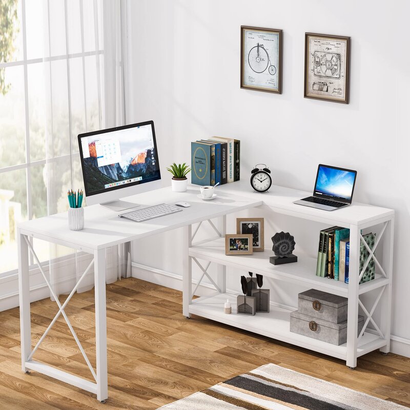 Sunlit white room. There's an L-shaped desk with a laptop open on it with books next to it.